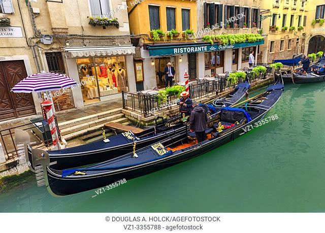 Gondoliers in Gondolas on Canal in Venice Italy World Location