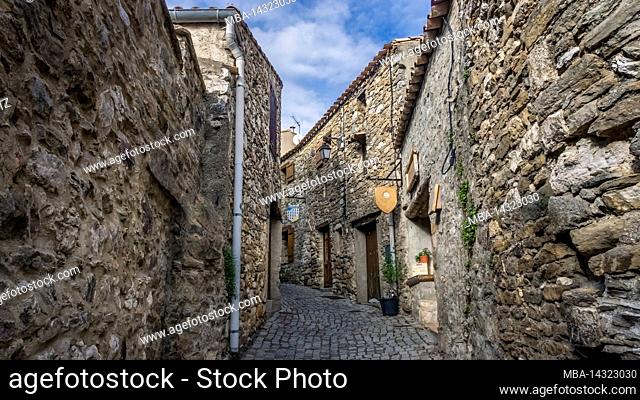 Alley in Minerve. The medieval village was built on a rock. Last refuge of the Cathars, one of the most beautiful villages in France (Les plus beaux villages de...