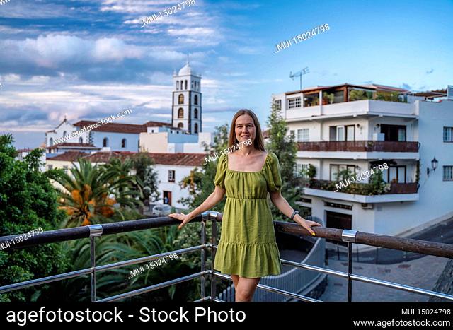 Landscape with Garachico town of Tenerife, Canary Islands, Spain. Happy carefree girl smiling