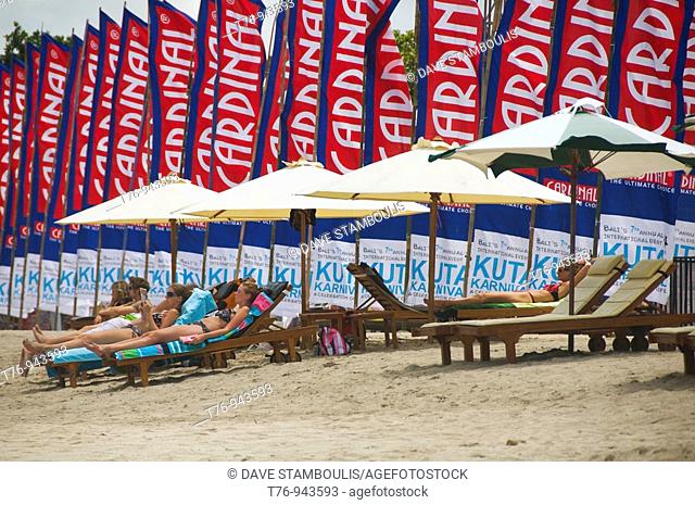 sunbathers on Kuta Beach in Bali Indonesia