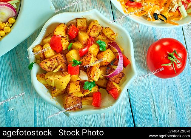 Southwest Roasted Potatoes flavors like red onions, bell peppers, and spices , Southwest cuisine, Traditional assorted American dishes, Top view