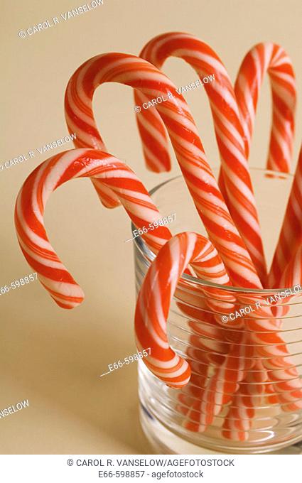 Christmas candy canes in clear glass