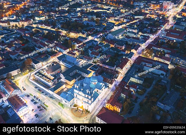 Grodno, Belarus. Night Aerial View Of Hrodna Cityscape Skyline. Popular Historic Landmark In Night Lightning. Famous Francis Xavier Cathedral