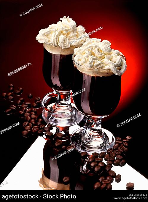 Still life with two cups of coffee with whipped cream