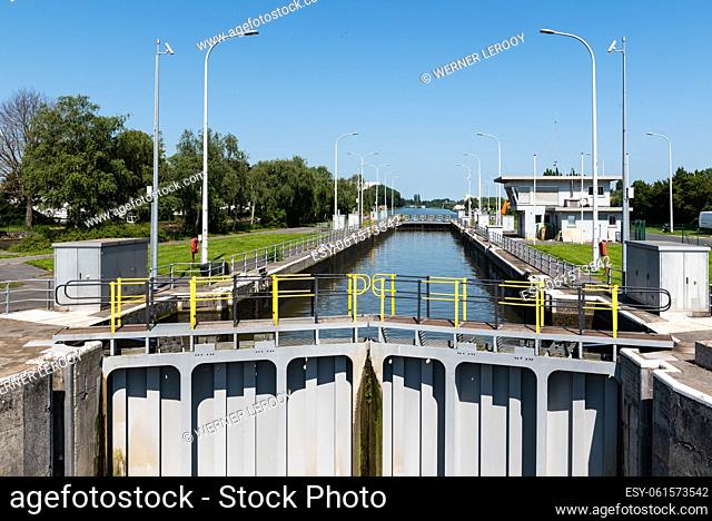 Ooigem, West Flemish Region, Belgium - 07 15 2021 Sluice gate at a canal