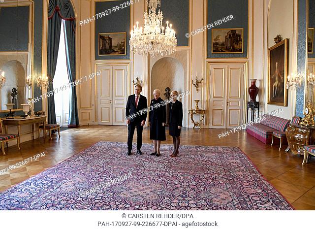 Daniel Guenther (CDU), Prime Minister of Schleswig-Holstein, stands next to the Danish Queen Margrethe II and Anke Meyer from the German embassy during a...