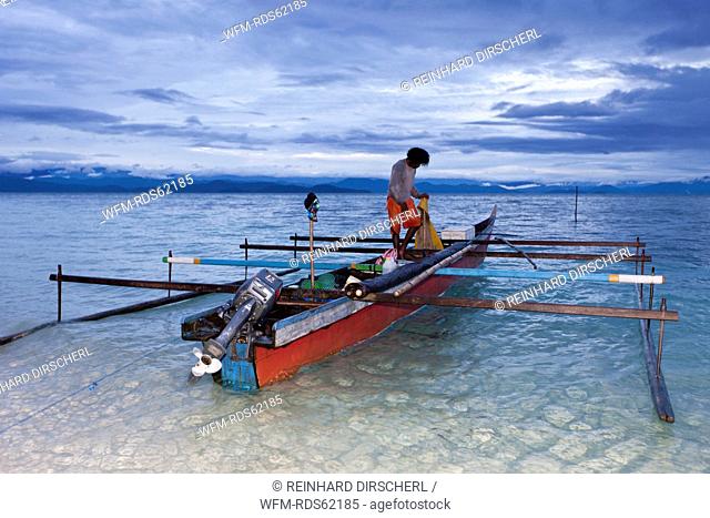 Fisherman on Outrigger Boat, Cenderawasih Bay, West Papua, Indonesia
