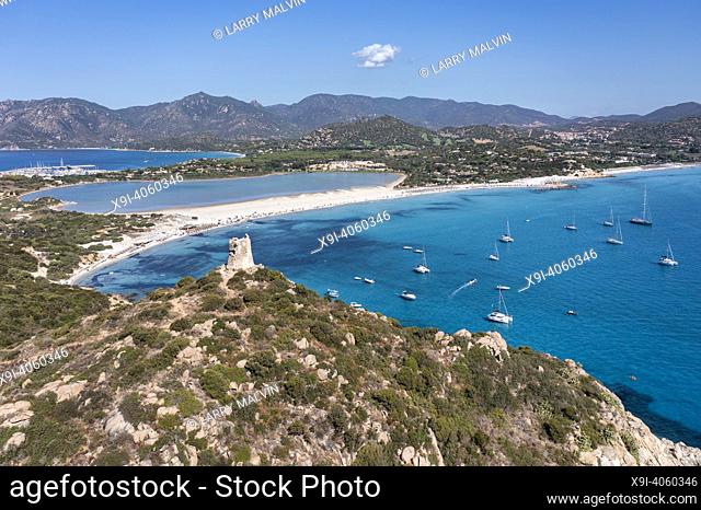 Aerial view of Spiaggia di Porto Giunco, a beautiful bay near a 17th century watchtower, The Aragonese Tower of Porto Giunco, in Sardinia, Italy