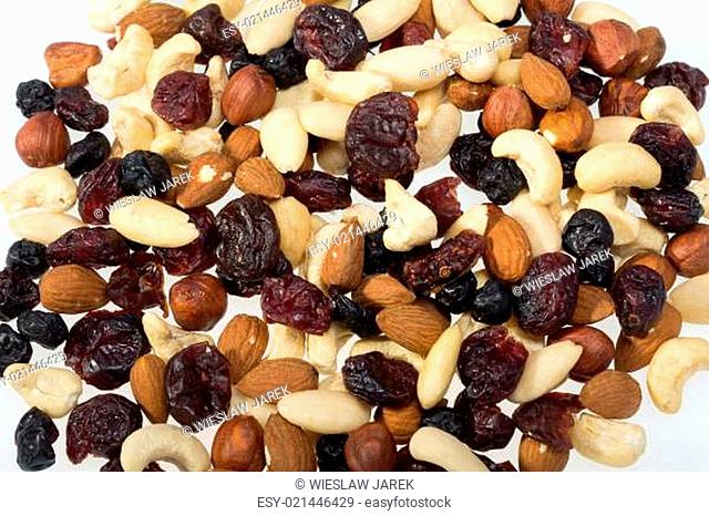 mixed nuts and dried fruits isolated on white background