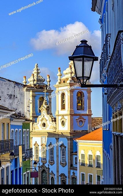 Colorful colonial houses facades and historic church towers in baroque and colonial style with blue sky in the famous Pelourinho district of Salvador, Bahia