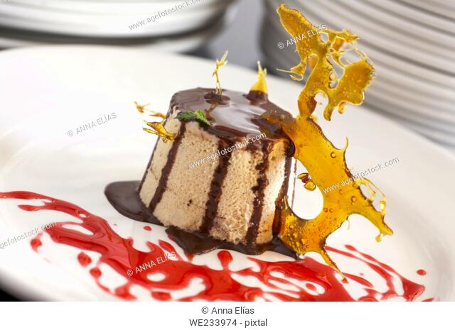 chocolate and nougat ice cream dessert with caramel and biscuit
