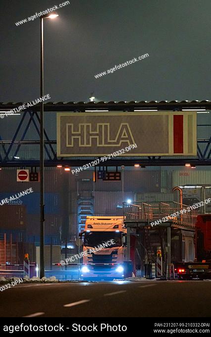 07 December 2023, Hamburg: The logo of HHLA (Hamburger Hafen und Logistik AG) at the Tollerort container terminal in the Port of Hamburg