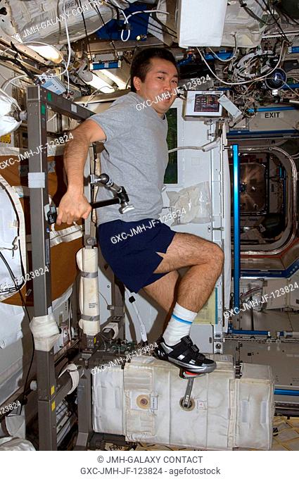 Japan Aerospace Exploration Agency (JAXA) astronaut Koichi Wakata, Expedition 20 flight engineer, exercises on the Cycle Ergometer with Vibration Isolation...