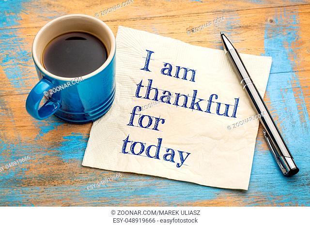 I am thankful for today - handwriting on a napkin with a cup of espresso coffee