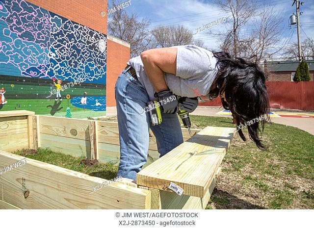 Detroit, Michigan - Volunteers from Muslim, Jewish, and other groups clean, paint, and landscape at Schulze Academy for Technology and Arts