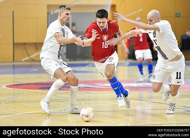 L-R Matej Fidejsek (SLO), Adam Knobloch (CZE) and Klemen Duscak (SLO) in action during the final match of Group D of the 2024 FIFA Futsal World Cup...