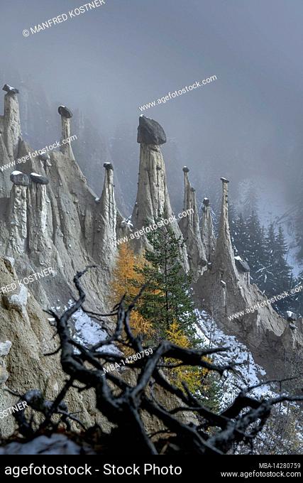 Percha, Province of Bolzano, South Tyrol. Italy. The first autumn snow at the earth pyramids of Platten above Percha in the Pustertal valley