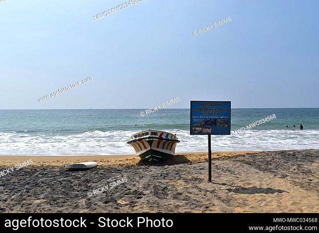 Boat stationed on shore at the Beach offering boat rides and fishing tours. Mount Lavinia Beach is the main sea-bathing spot in Colombo