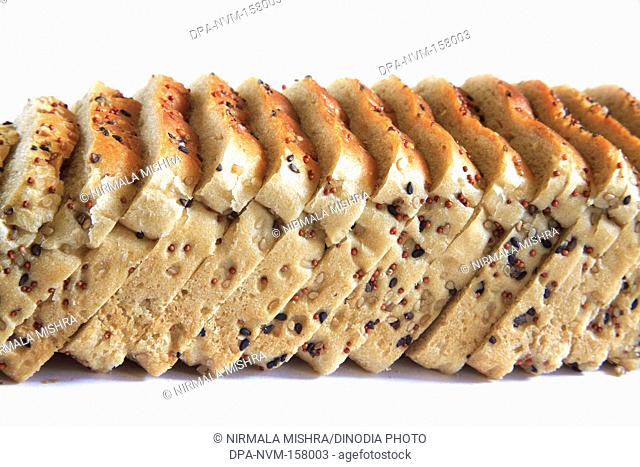 Multigrain pure vegetarian wheat bread slices with white and black sesame seeds on white background