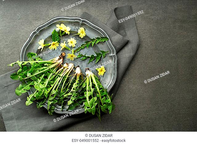 Fresh dandelion leaves overhead shoot. Healthy spring natural organic food concept - Image