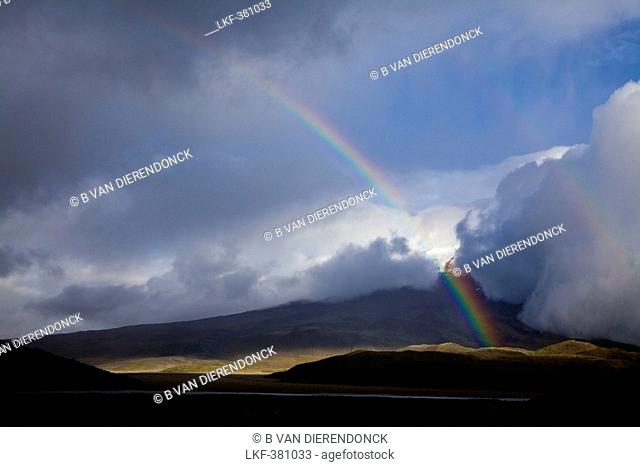 Mist, clouds and rainbow on Cotopaxi 5897m, in the foreground: Limpiopungo Lagoon, Andes, Ecuador, South America