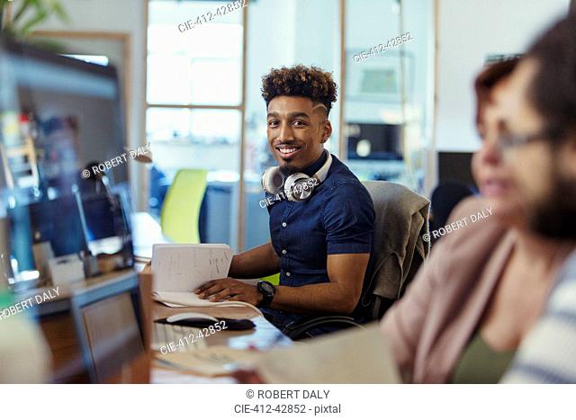 Portrait smiling, confident creative businessman working in office