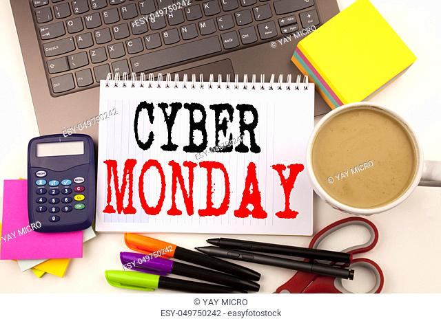 Word writing Cyber Monday in the office with surroundings such as laptop, marker, pen, stationery, coffee. Business concept for Retail Shop Discount Workshop...