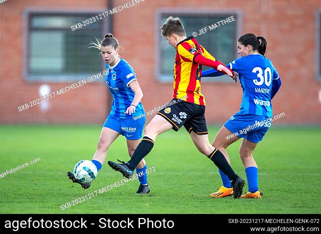 Aster Janssens (20) of KV Mechelen and Luna Vanzeir (30) of Genk and Lyndsey Van Belle (14) of Genk battle for the ball pictured during a female soccer game...