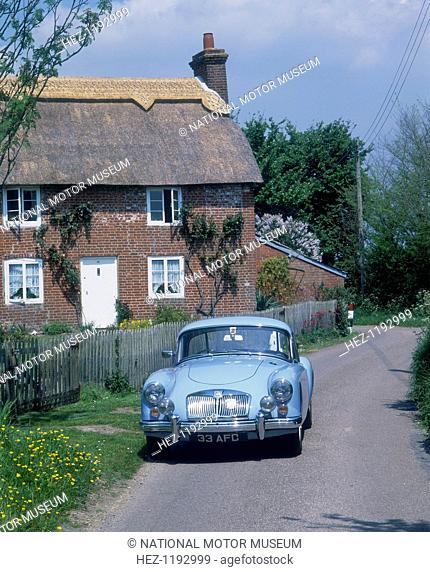 1959 MGA Twin Cam Coupe. An MGA Twin Cam Coupe is parked outside a house on a quiet road. Sales of the car were disappointing