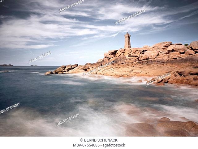 Pink Granite Coast with impressive pink granite rocks and Phare de Ploumanac'h lighthouse