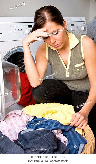 desperate woman doing the laundry