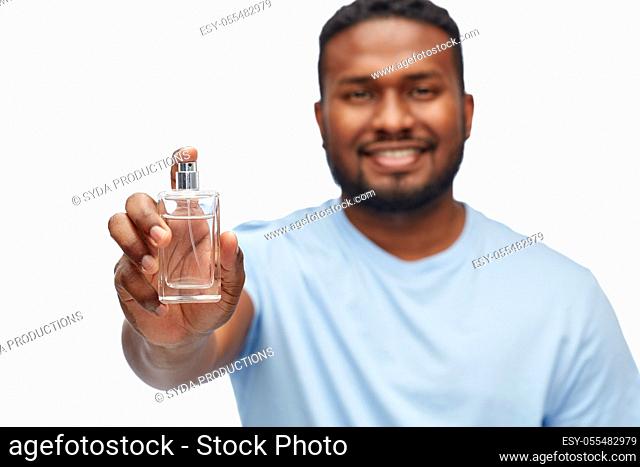 happy african american man with perfume
