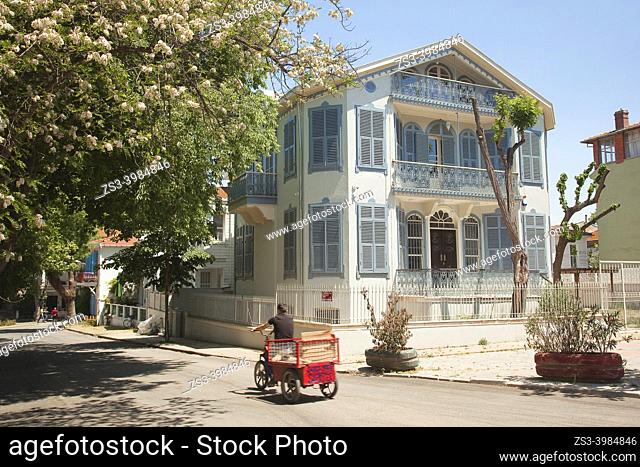 Cyclist in front of the traditional wooden houses in Büyükada, Buyukada-Prinkipos, the largest of the Princes' Islands, Marmara Sea, Istanbul Turkey, Europe
