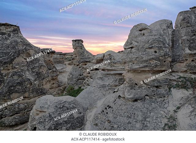 Rock formations and hoodoos at sunset at Writing-on-Stone provincial park, Alberta, Canada