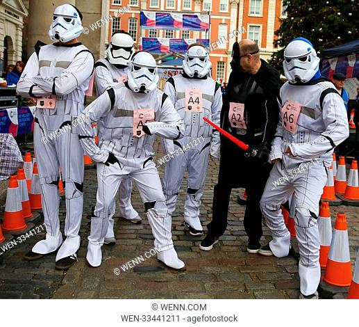 Fourteen teams takes part in The Great Christmas Pudding Race in Covent Garden in London. Participants dresses fancy costumes competes in the fun race to raise...