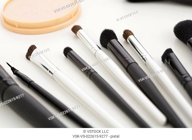 Make-up brushes in a row on table