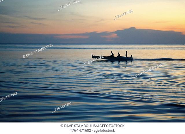 fishermen at sunset on Mabul Island, Borneo, Malaysia