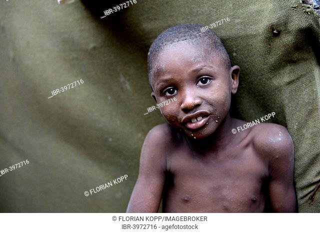 Skinny boy, portrait, Camp Icare for earthquake refugees, Fort National, Port-au-Prince, Haiti