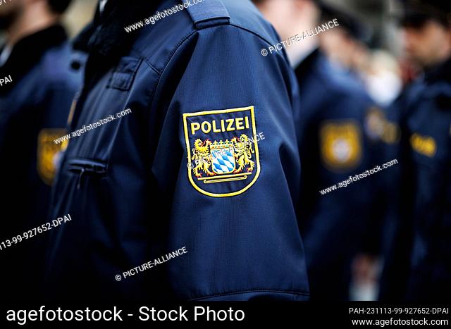 09 November 2023, Bavaria, Munich: The sleeve badge of the Bavarian state police, a coat of arms with the word ""Polizei"" (""Police"") with the large state...