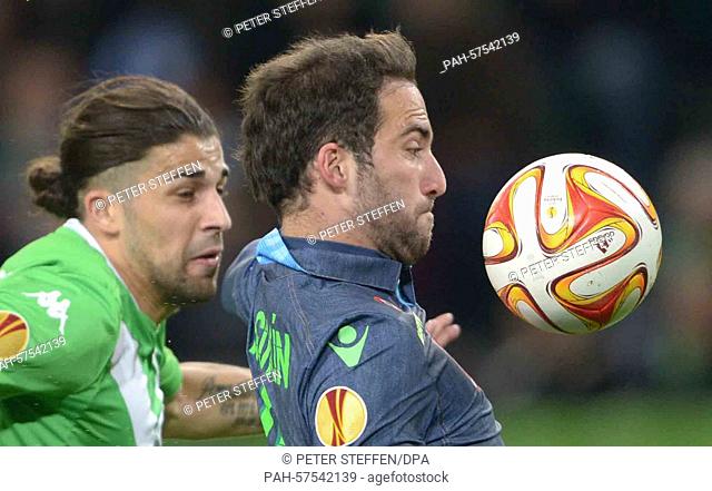 Wolfsburg's Ricardo Rodriguez (L) and Napoli's Gonzalo Higuain vie for the ball at the Europa League quarter finals first-leg match between VfL Wolfsburg and...