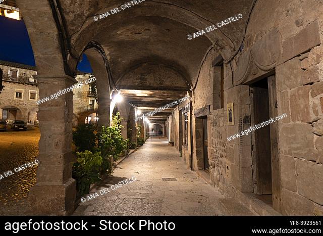 Santa Pau village in Girona, Catalonia, Spain. The medieval city by night. The illuminated main square