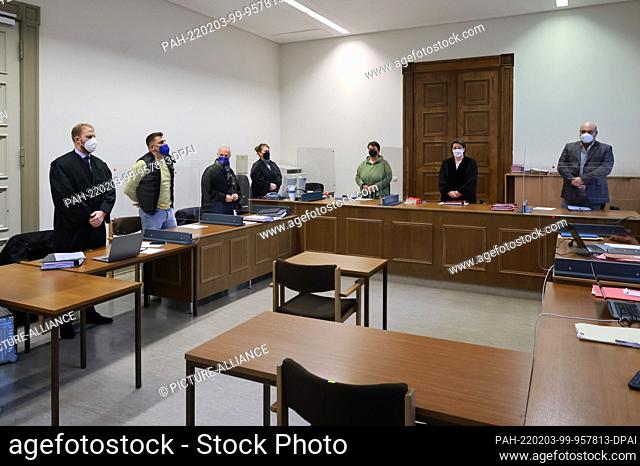 03 February 2022, Hamburg: Rapper Gzuz (2nd from left) waits in the courtroom of the Criminal Justice Building in Hamburg for the continuation of the appeal...