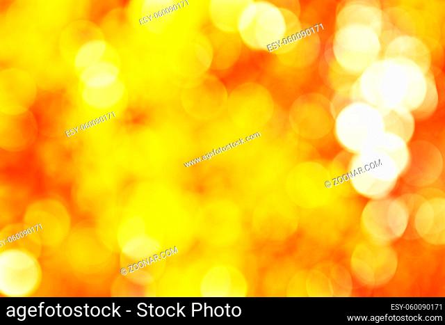 Abstact vibrant golden, yellow, orange circle bokeh background texture