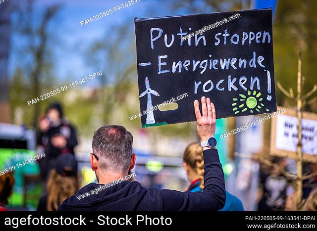 29 April 2022, Mecklenburg-Western Pomerania, Schwerin: Participants stand at the protest action of activists of Fridays for Future at the Old Garden