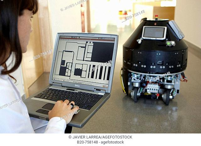 Researcher demonstrating a robot autonomous navigation capability using environment representation, Fatronik-Tecnalia, Research and Technology Center, Donostia