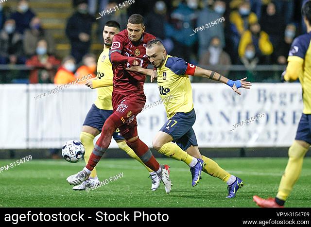 Mechelen's Vinicius Souza and Union's Teddy Teuma fight for the ball during a soccer match between Union Saint-Gilloise and KV Mechelen