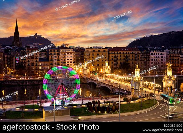 Ferris wheel at sunset, Urumea River, Maria Cristina bridge, Donostia, San Sebastian, Basque Country, Spain
