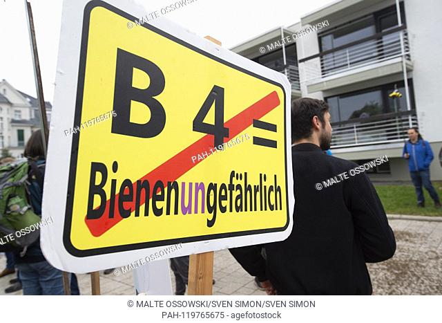 Poster with inscription, AûB4 - Bees (in) Dangerous, 'Aú activists protest against the merger of Bayer and Monsanto, versus glyphosate