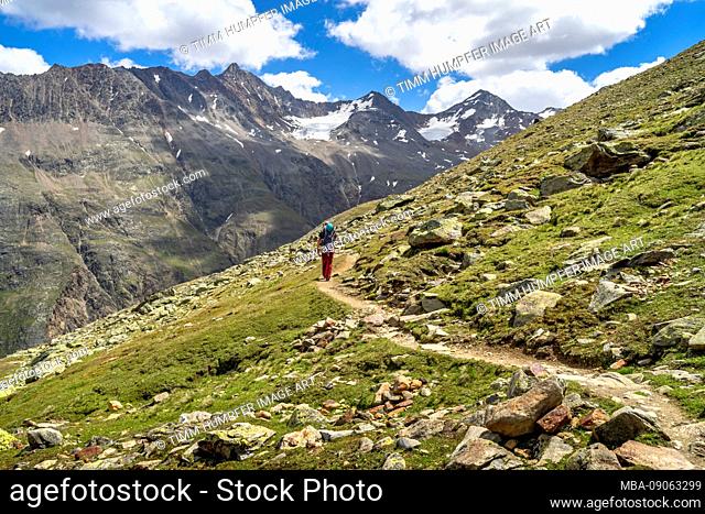 Europe, Austria, Tyrol, Ötztal Alps, Vent, hiker on the trail between Vernagthütte and Hochjochhospiz