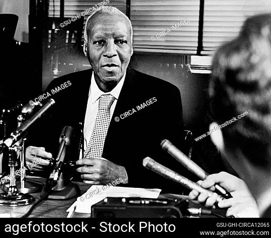A. Philip Randolph (1889-1979), American labor unionist and civil rights activist, half-length portrait at microphones during press conference, Ed Ford